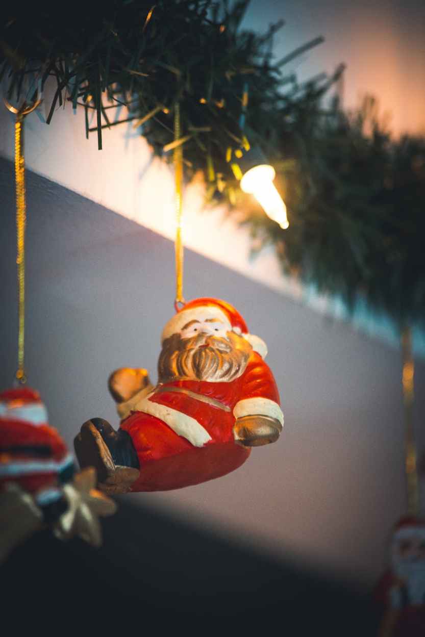 selective focus photography of santa clause hanging decor